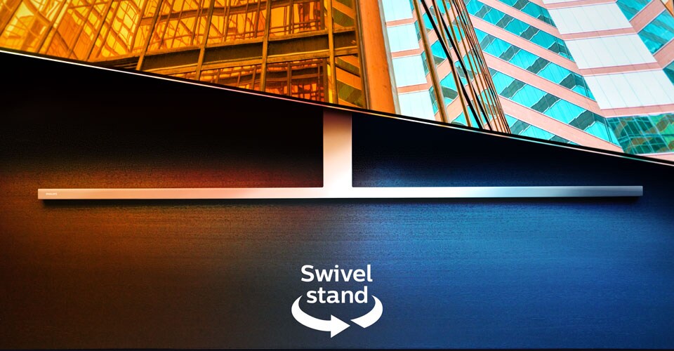 „Philips Ambilight“ televizorius ant pasukamo stovo, kuriame pavaizduotos dvi spalvingos architektūrinės scenos su rodykle ir tekstu, nurodančiu pasukimo funkciją